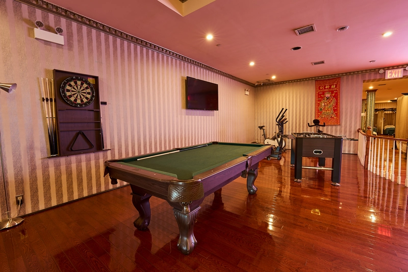 Game room with pool table and dartboard